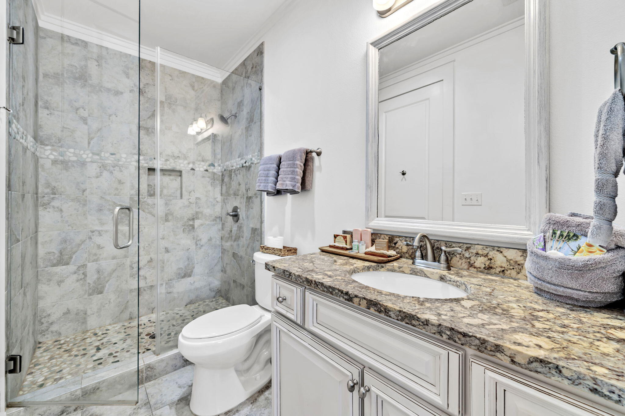 36 Moonlight Beach Lane Inlet Beach, FL 32461 - Photo 30 of 60 a bathroom with a granite countertop sink a toilet a mirror and shower
