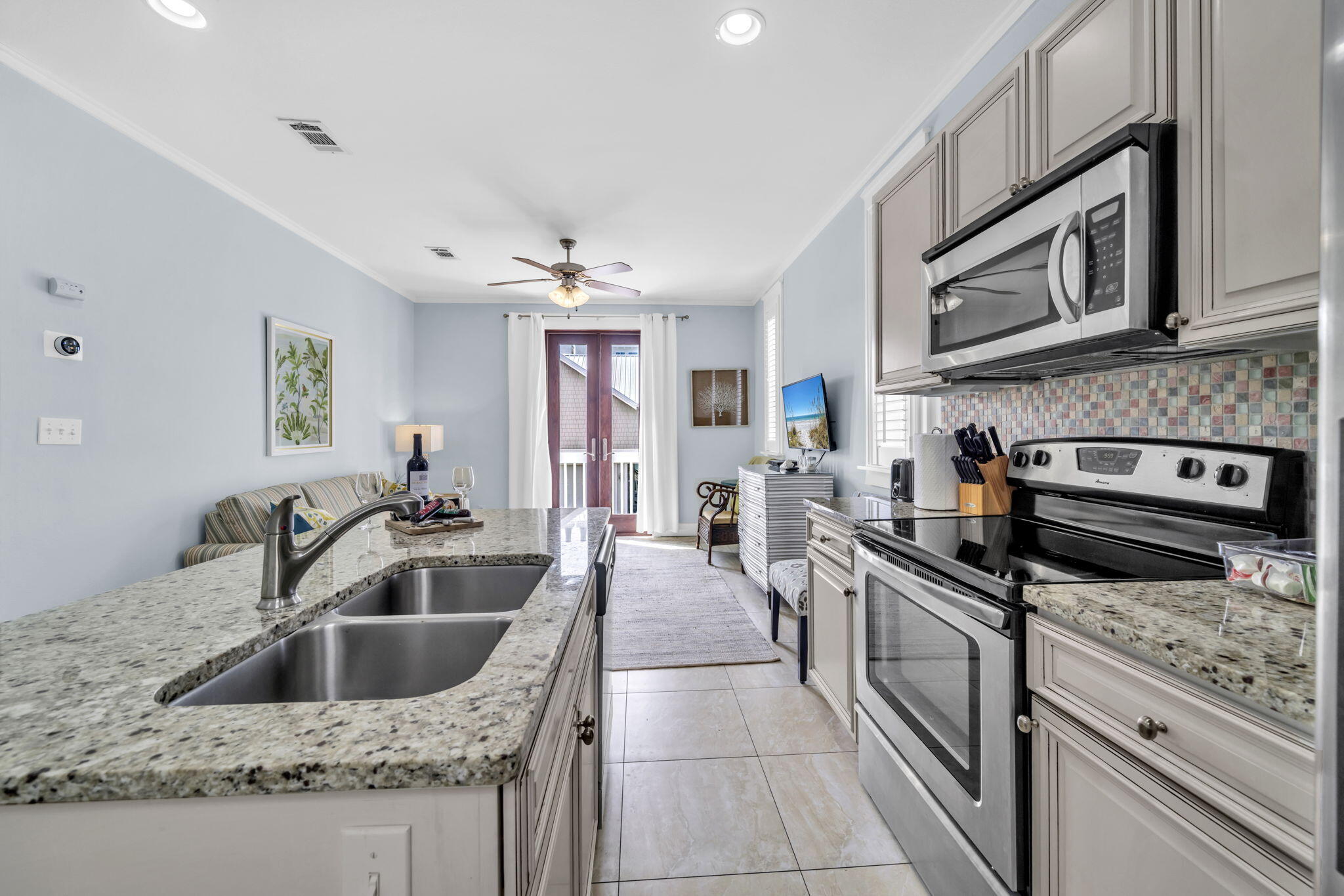 36 Moonlight Beach Lane Inlet Beach, FL 32461 - Photo 34 of 60 a kitchen with stainless steel appliances granite countertop a sink and stove