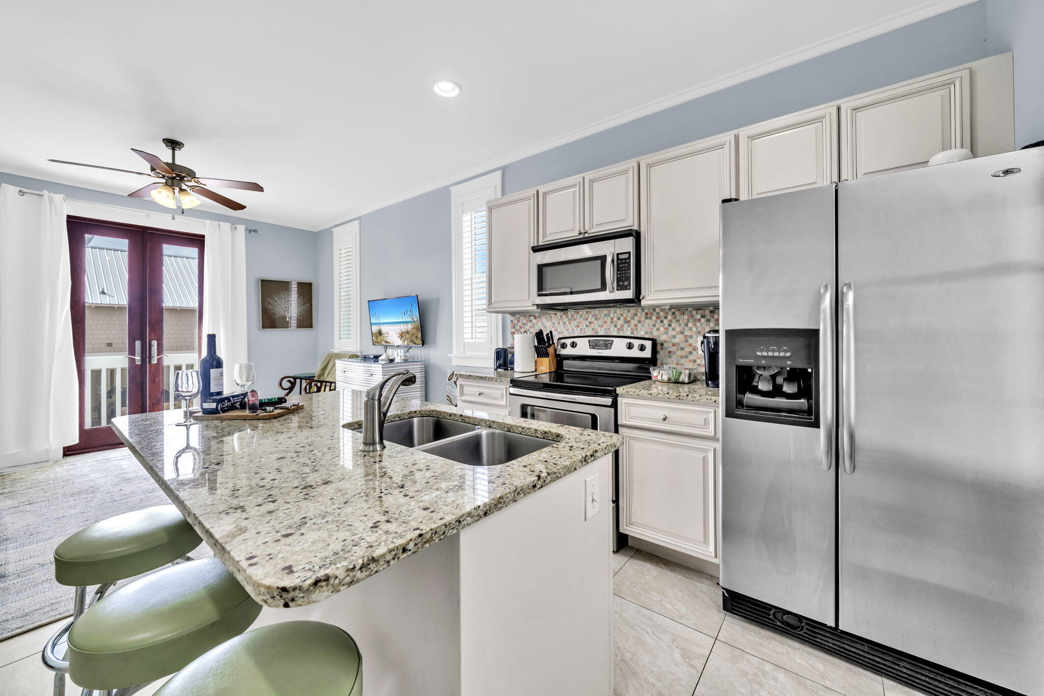 36 Moonlight Beach Lane Inlet Beach, FL 32461 - Photo 35 of 60 a kitchen with stainless steel appliances granite countertop a sink a refrigerator and a refrigerator