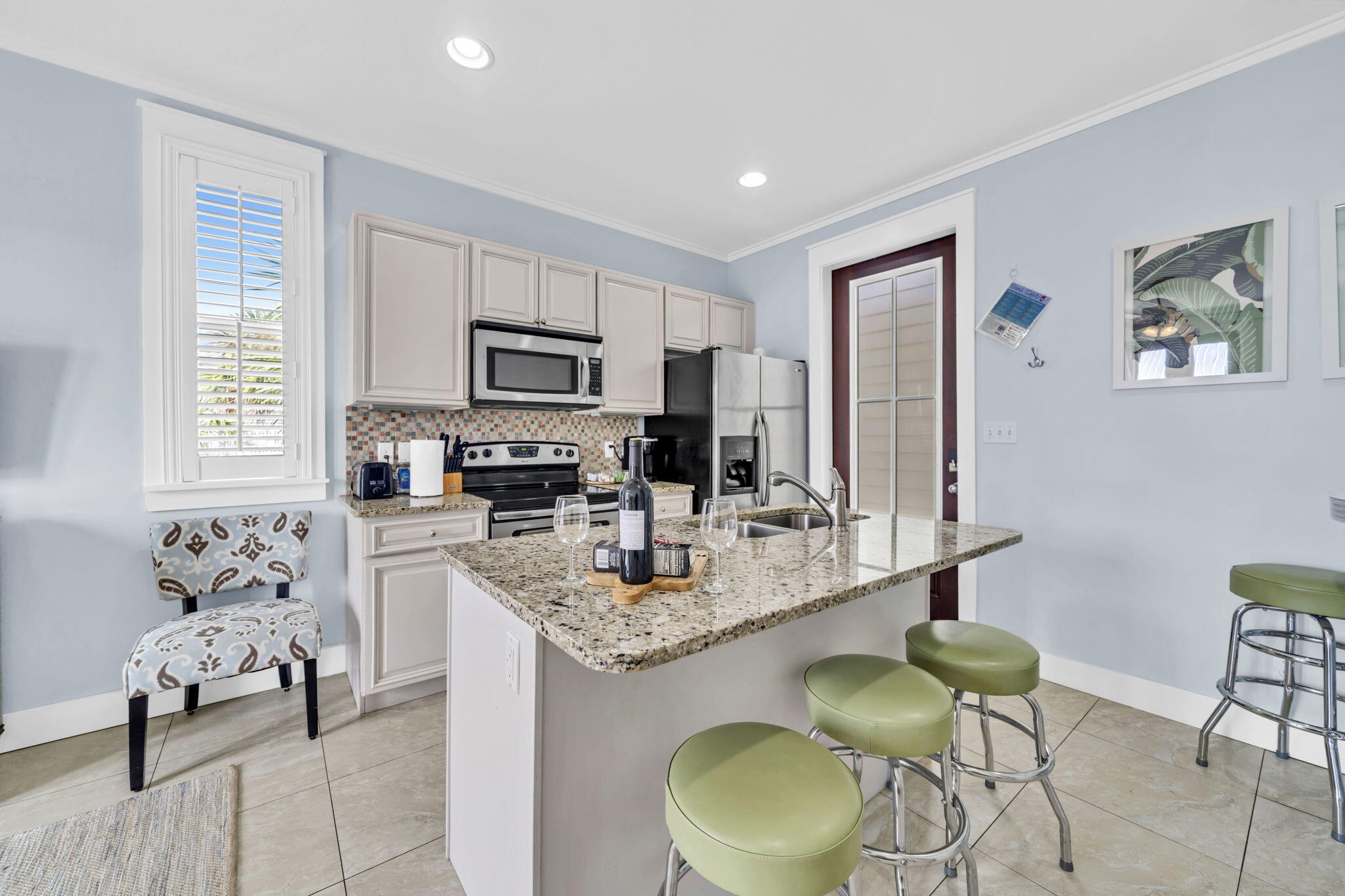 36 Moonlight Beach Lane Inlet Beach, FL 32461 - Photo 38 of 60 a kitchen with granite countertop stainless steel appliances a sink a stove a refrigerator cabinets and dining table