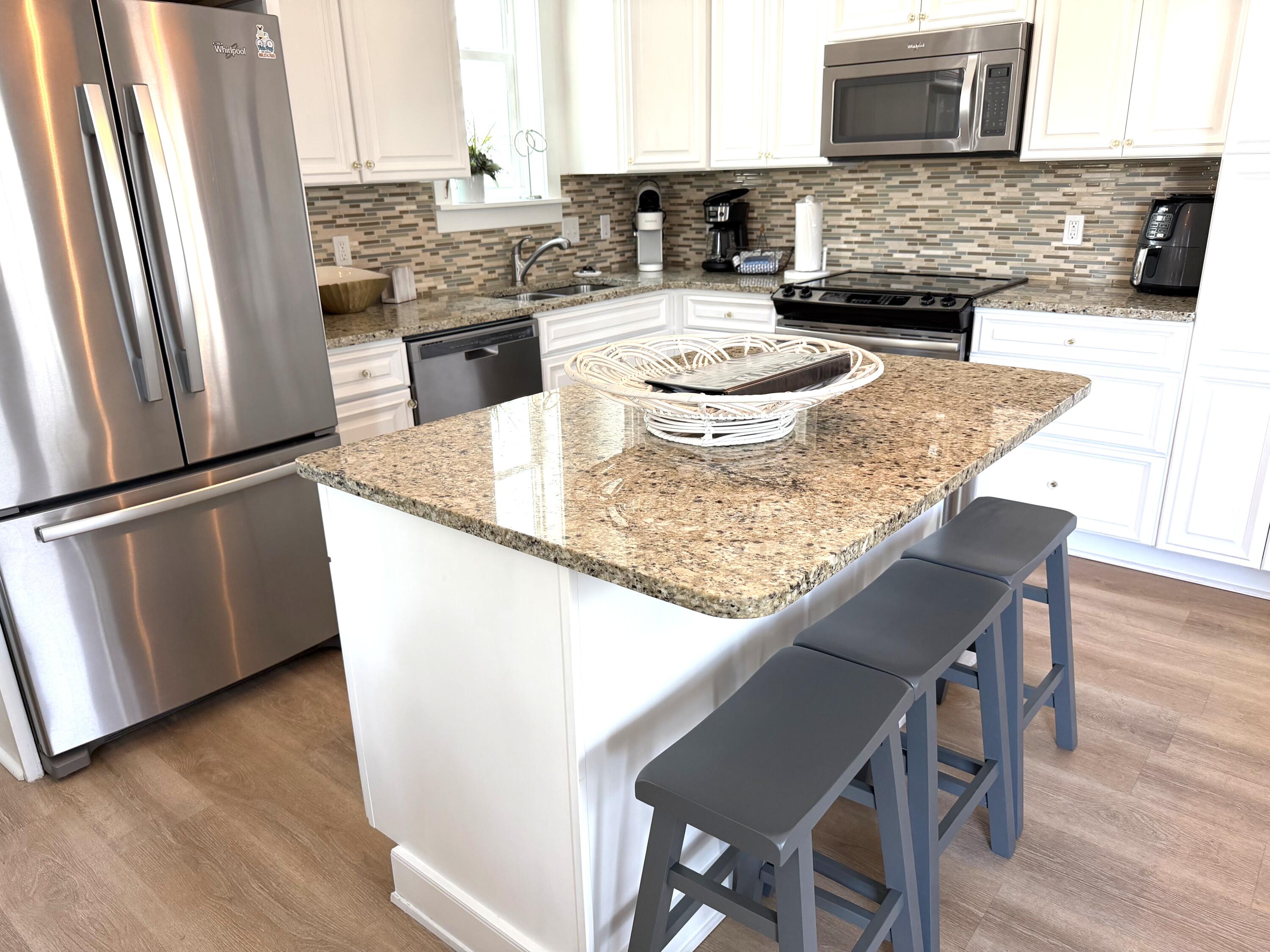 36 Moonlight Beach Lane Inlet Beach, FL 32461 - Photo 10 of 60 a kitchen with a table and chairs