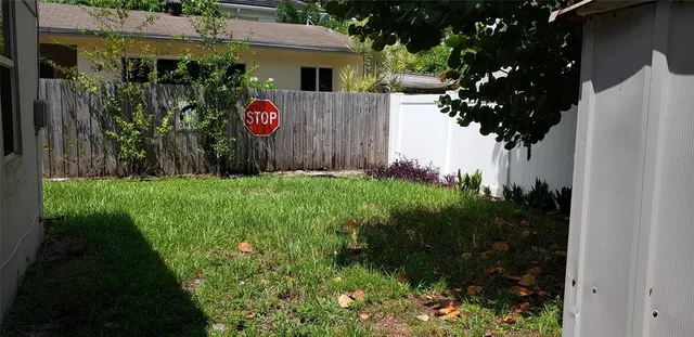 a view of a back yard of the house