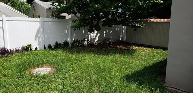 a backyard of a house with lots of green space