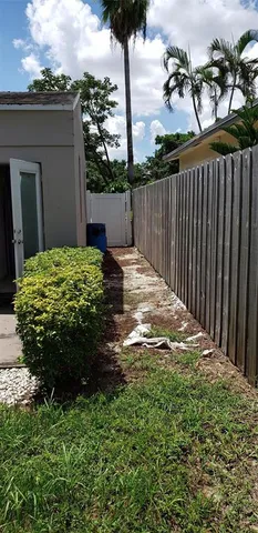 a backyard of a house with lots of green space