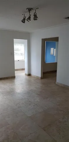 a view of an empty room with a window