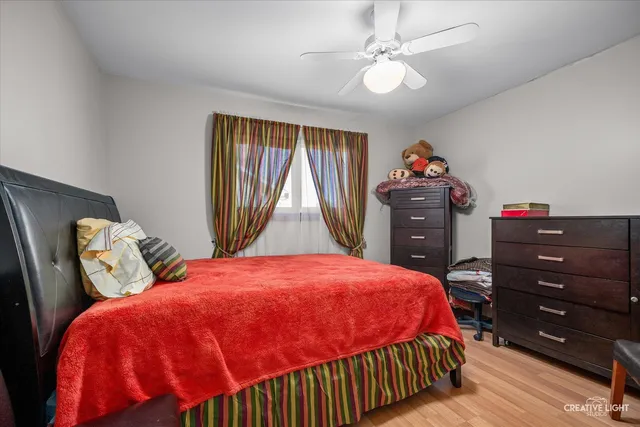 a bedroom with a bed and a dresser