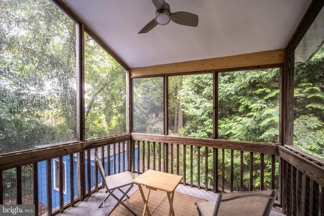 a room with a window and potted plant