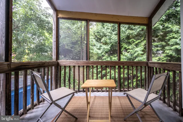 a bathroom with a sink toilet a mirror and shower
