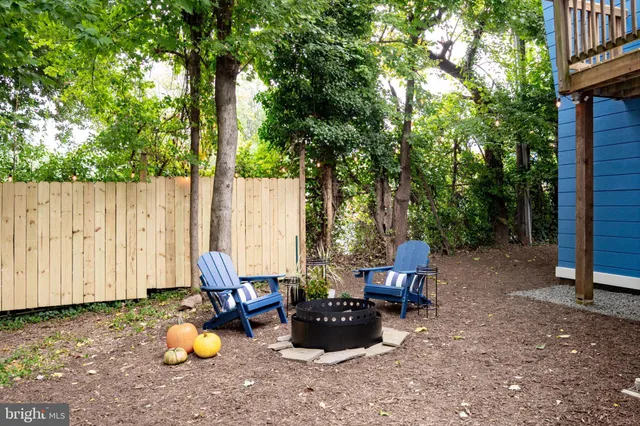 a view of a chair and table on the deck