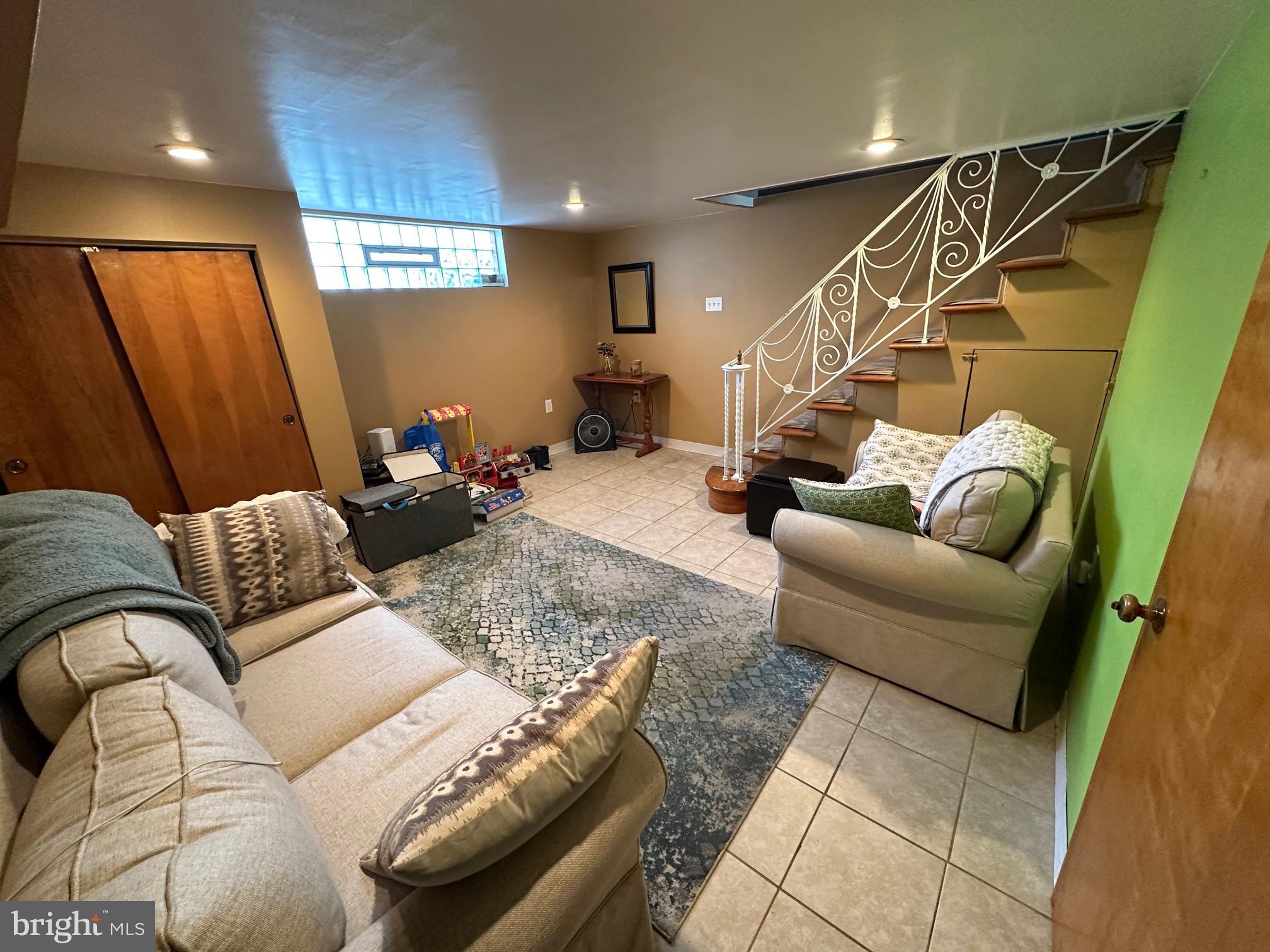 1818 Packer Avenue Philadelphia, PA 19145 - Photo 17 of 23 a living room with furniture and a couch