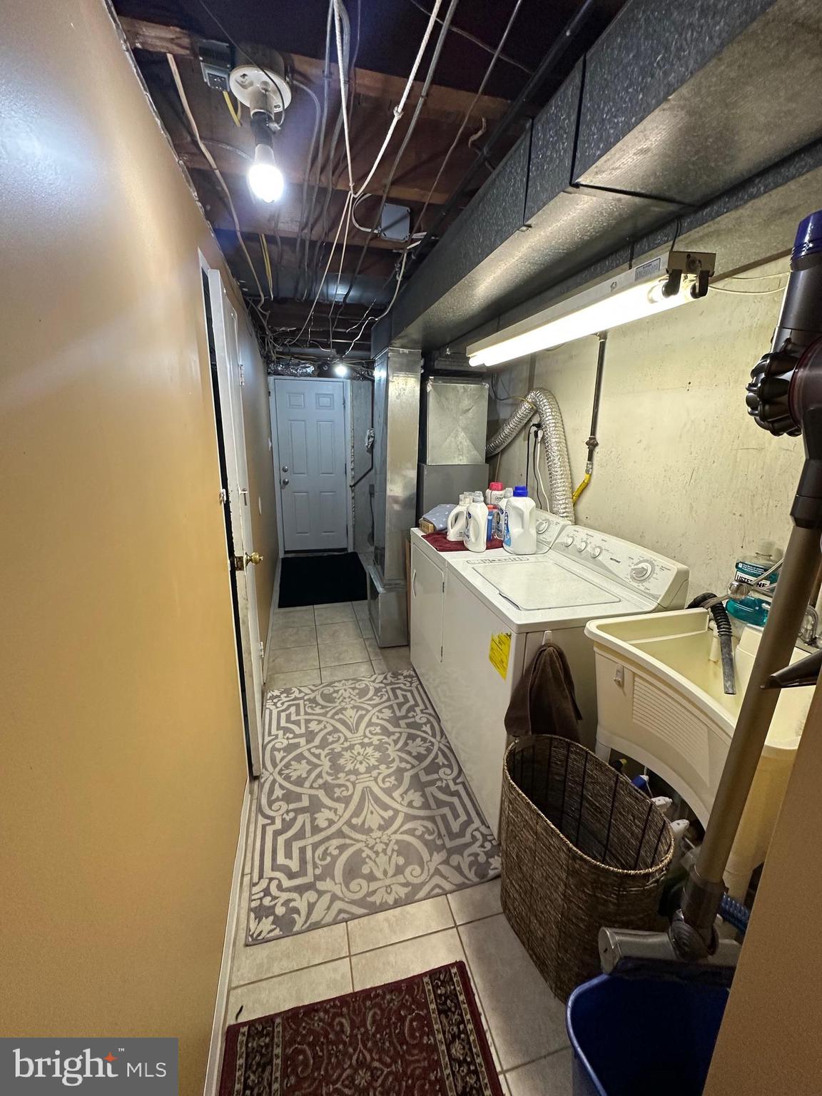 1818 Packer Avenue Philadelphia, PA 19145 - Photo 20 of 23 a utility room with dryer and washer