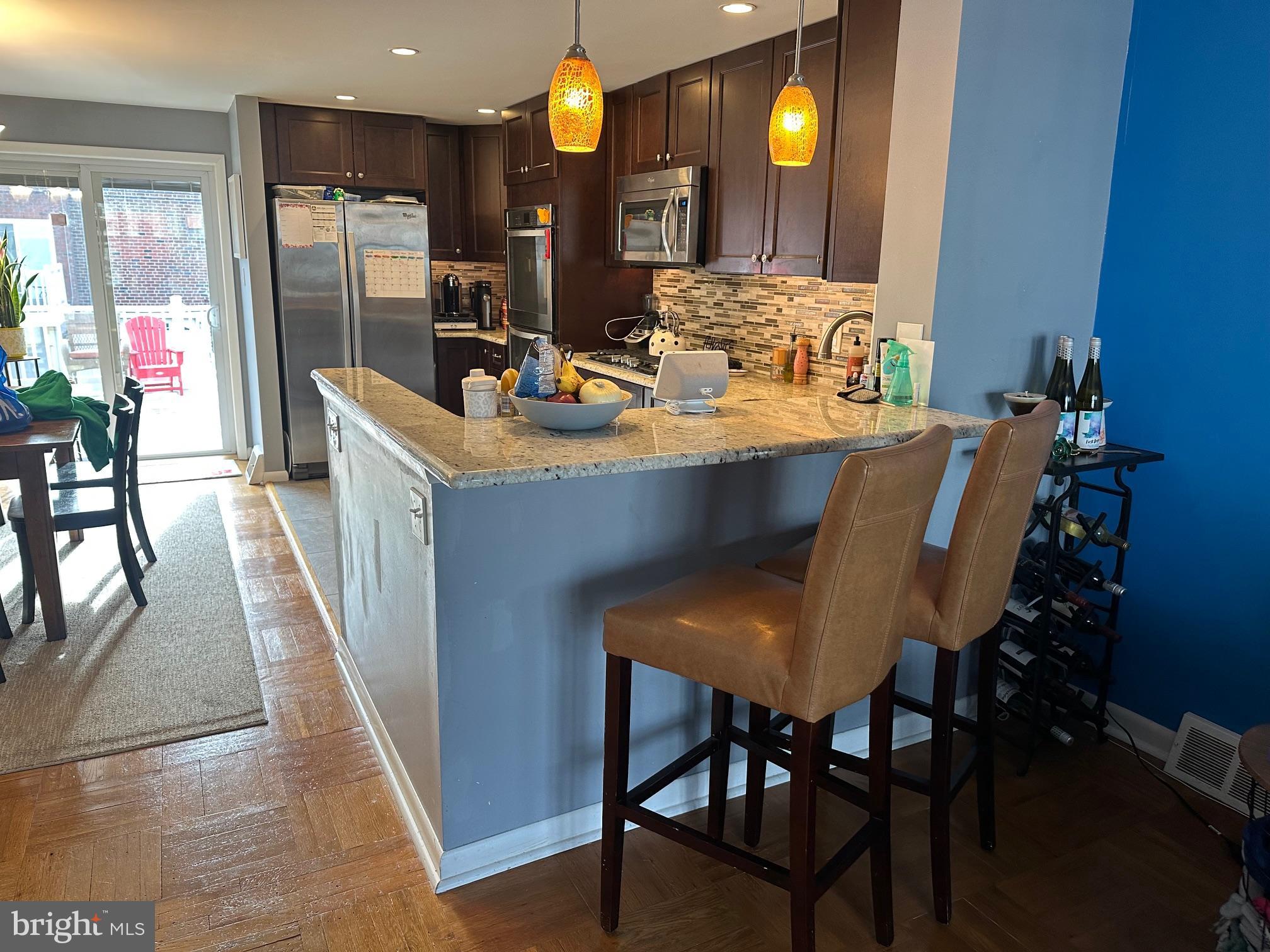 1818 Packer Avenue Philadelphia, PA 19145 - Photo 7 of 23 a view of a dining room with furniture and chandelier