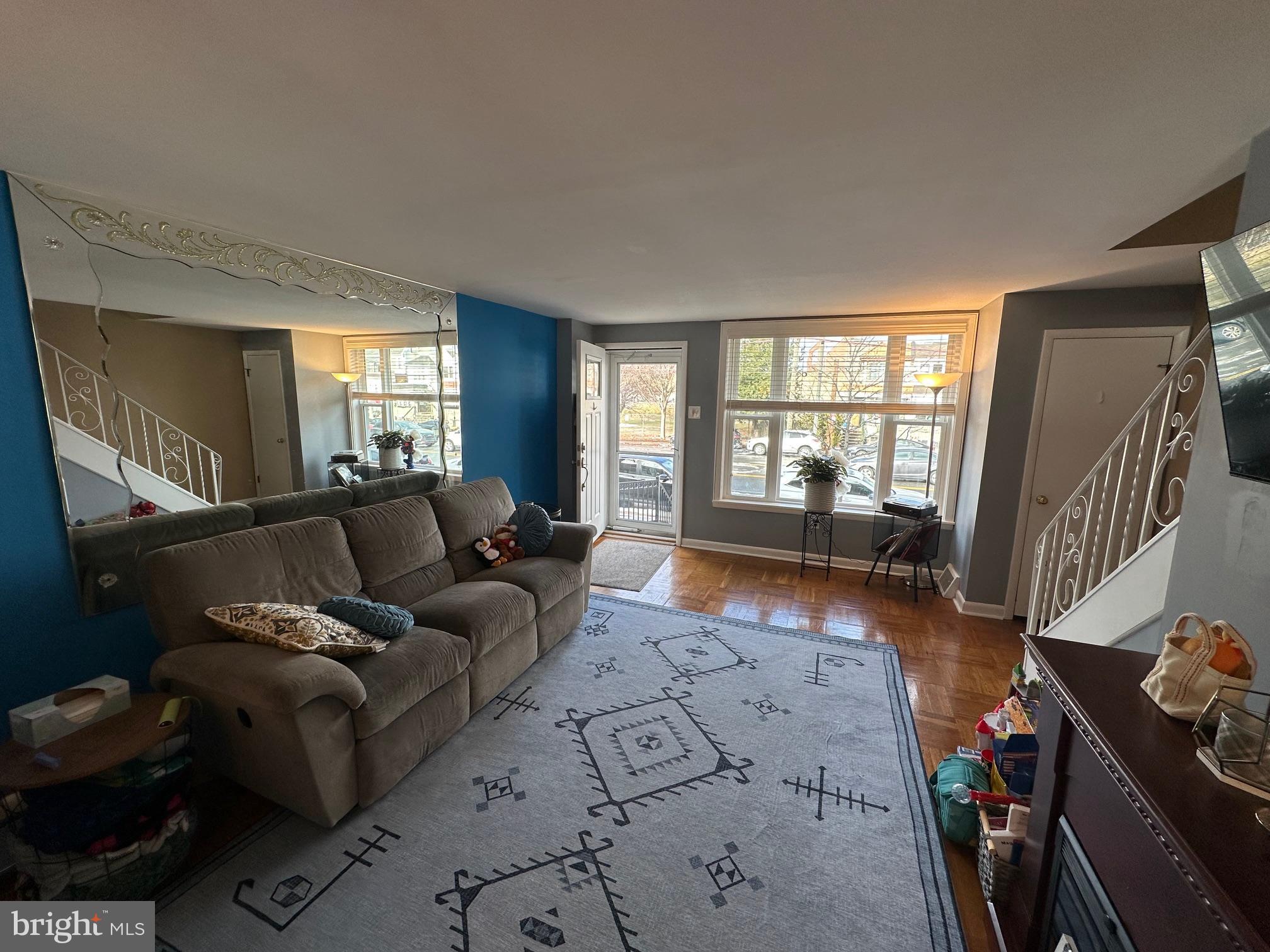 1818 Packer Avenue Philadelphia, PA 19145 - Photo 10 of 23 a living room with furniture and a wooden floor