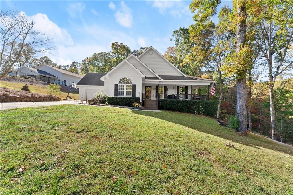 125 Rainbow Circle Cleveland, GA 30528 - Photo 2 of 83 a front view of a house with a yard and trees