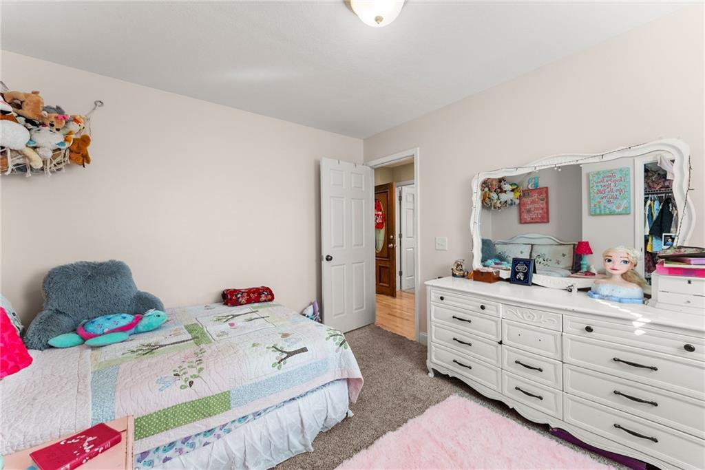 125 Rainbow Circle Cleveland, GA 30528 - Photo 21 of 83 a bedroom with a bed and a dresser in it