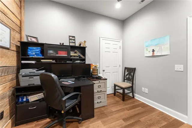 a spacious bathroom with a granite countertop sink a toilet and a mirror