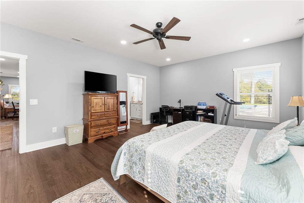 125 Rainbow Circle Cleveland, GA 30528 - Photo 53 of 83 a bedroom with a bed and a flat screen tv