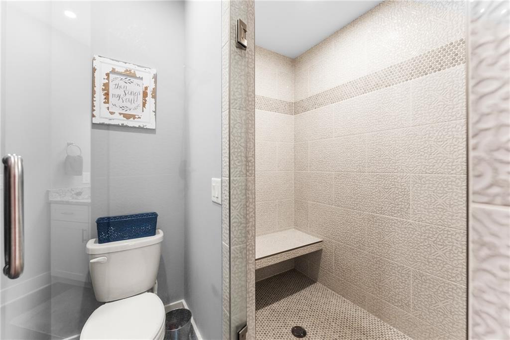 125 Rainbow Circle Cleveland, GA 30528 - Photo 56 of 83 a white toilet sitting next to a bathroom sink