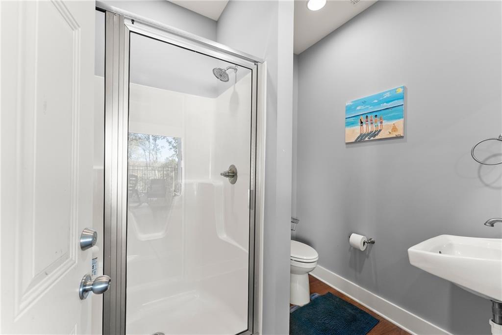 125 Rainbow Circle Cleveland, GA 30528 - Photo 62 of 83 a bathroom with a shower a toilet and a sink