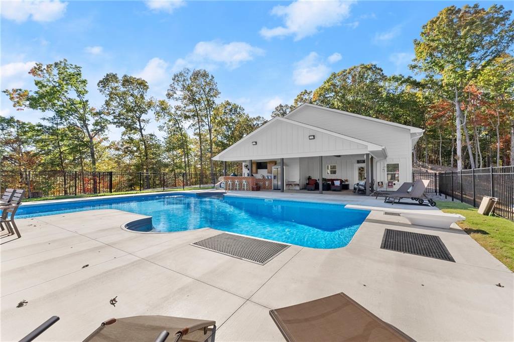 125 Rainbow Circle Cleveland, GA 30528 - Photo 68 of 83 a view of a house with swimming pool