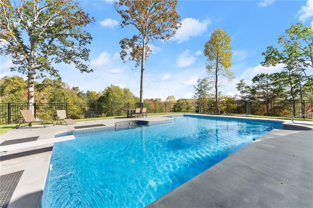 125 Rainbow Circle Cleveland, GA 30528 - Photo 69 of 83 a view of a swimming pool with a lake view