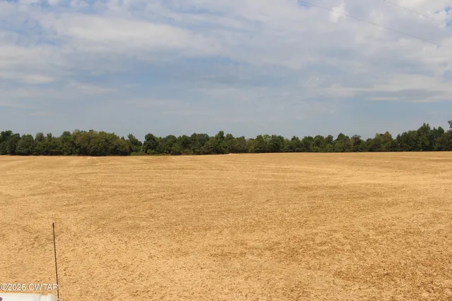 a view of a lake and city in the back