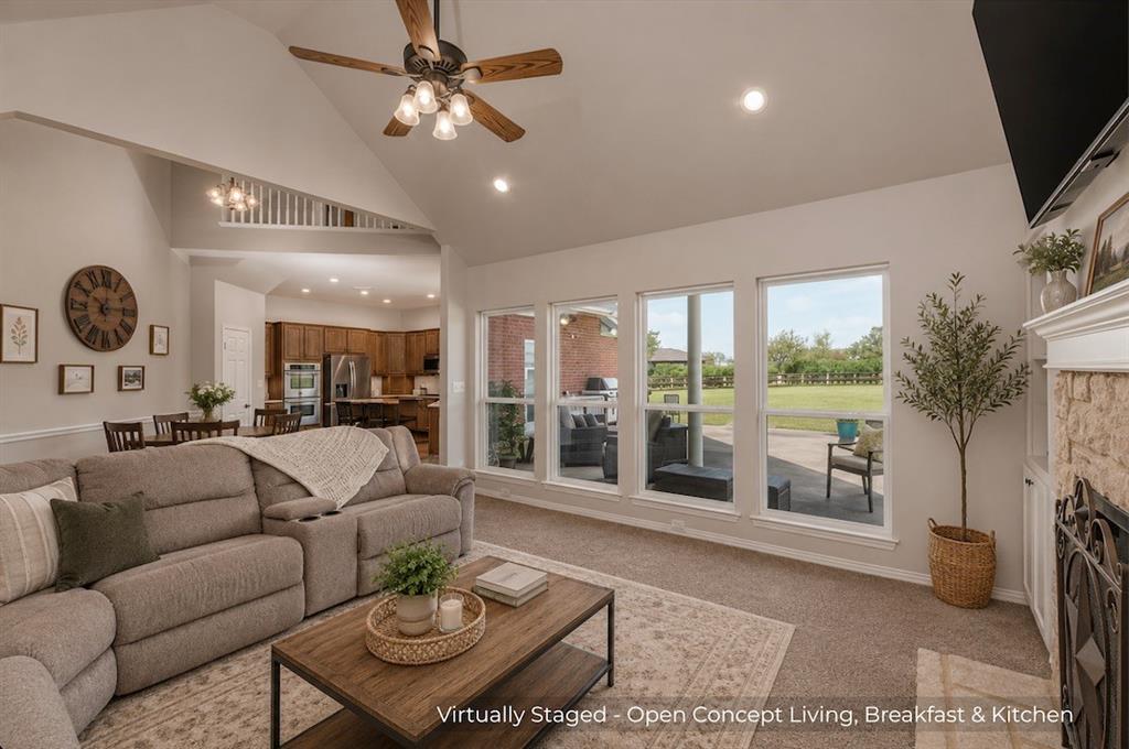 15 Trail Ridge Drive Melissa, TX 75454 - Photo 13 of 38 a living room with furniture a flat screen tv and a large window