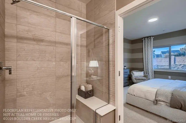 a bedroom with a bed and a shower