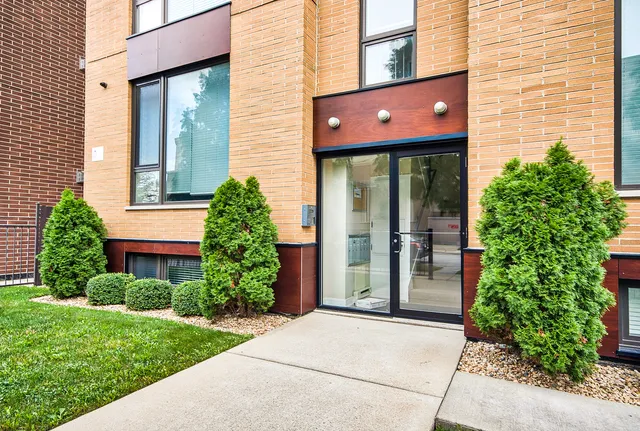 a view of kitchen with wooden floor and electronic appliances