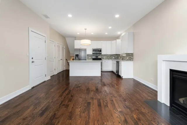 a kitchen with a stove a sink and a refrigerator