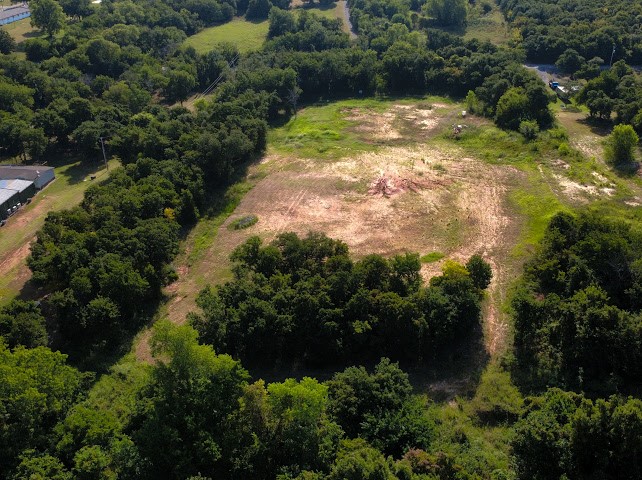 Pleasant Ridge Jones, OK 73049 - Photo 6 of 21 Expansive cleared land area surrounded by dense mature trees