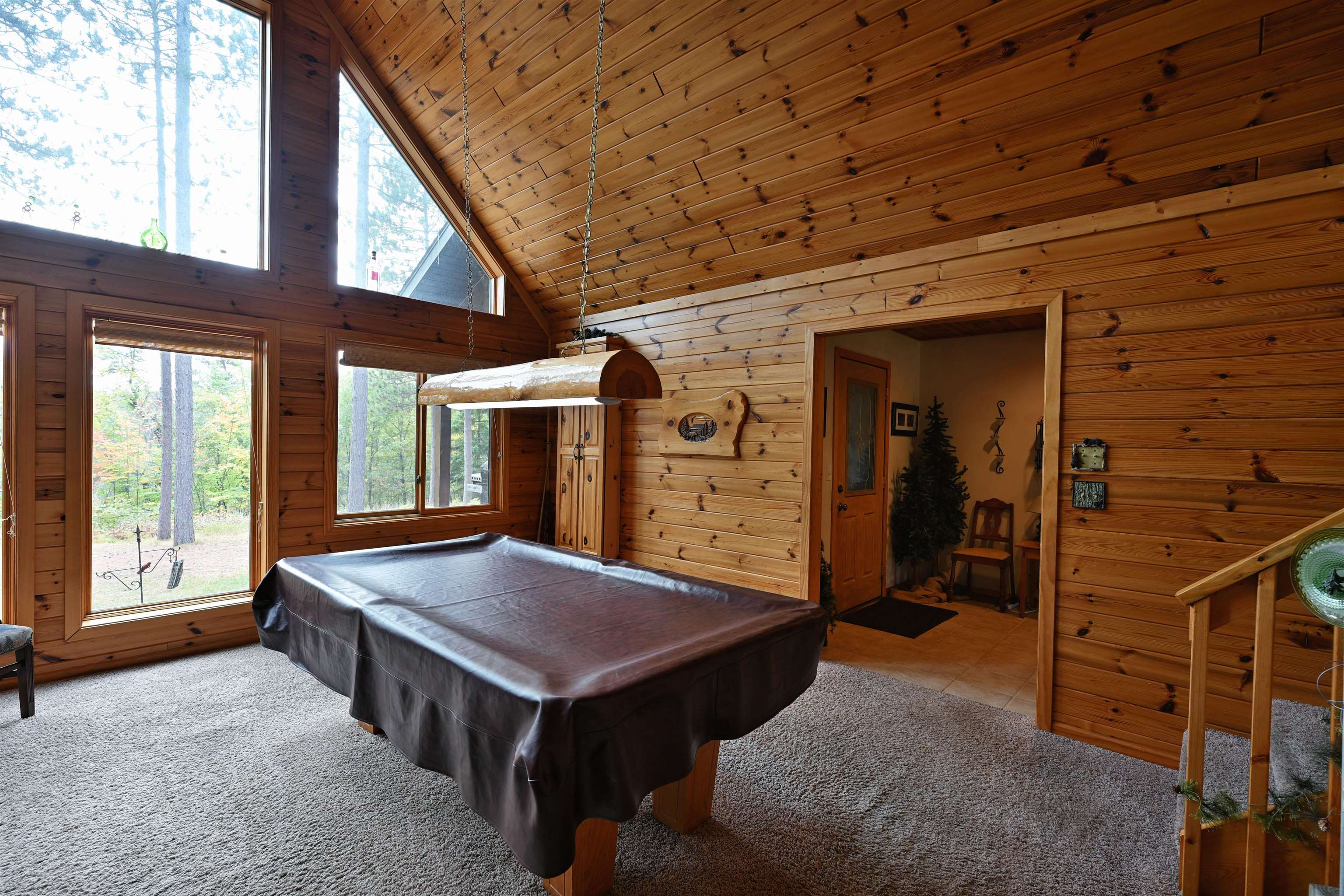13672 East Short Road Gordon, WI 54838 - Photo 49 of 75 Recreation room with wood walls, carpet flooring, high vaulted ceiling, pool table, and wood ceiling