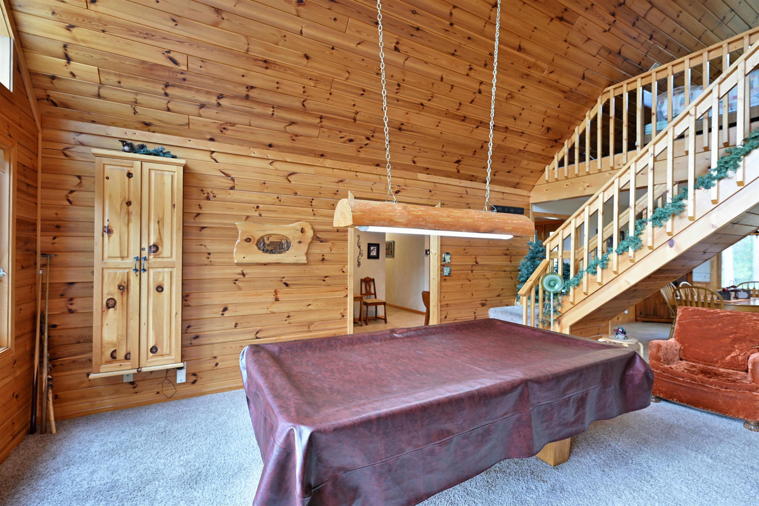 13672 East Short Road Gordon, WI 54838 - Photo 56 of 75 Playroom featuring pool table, carpet, wood walls, wooden ceiling, and high vaulted ceiling