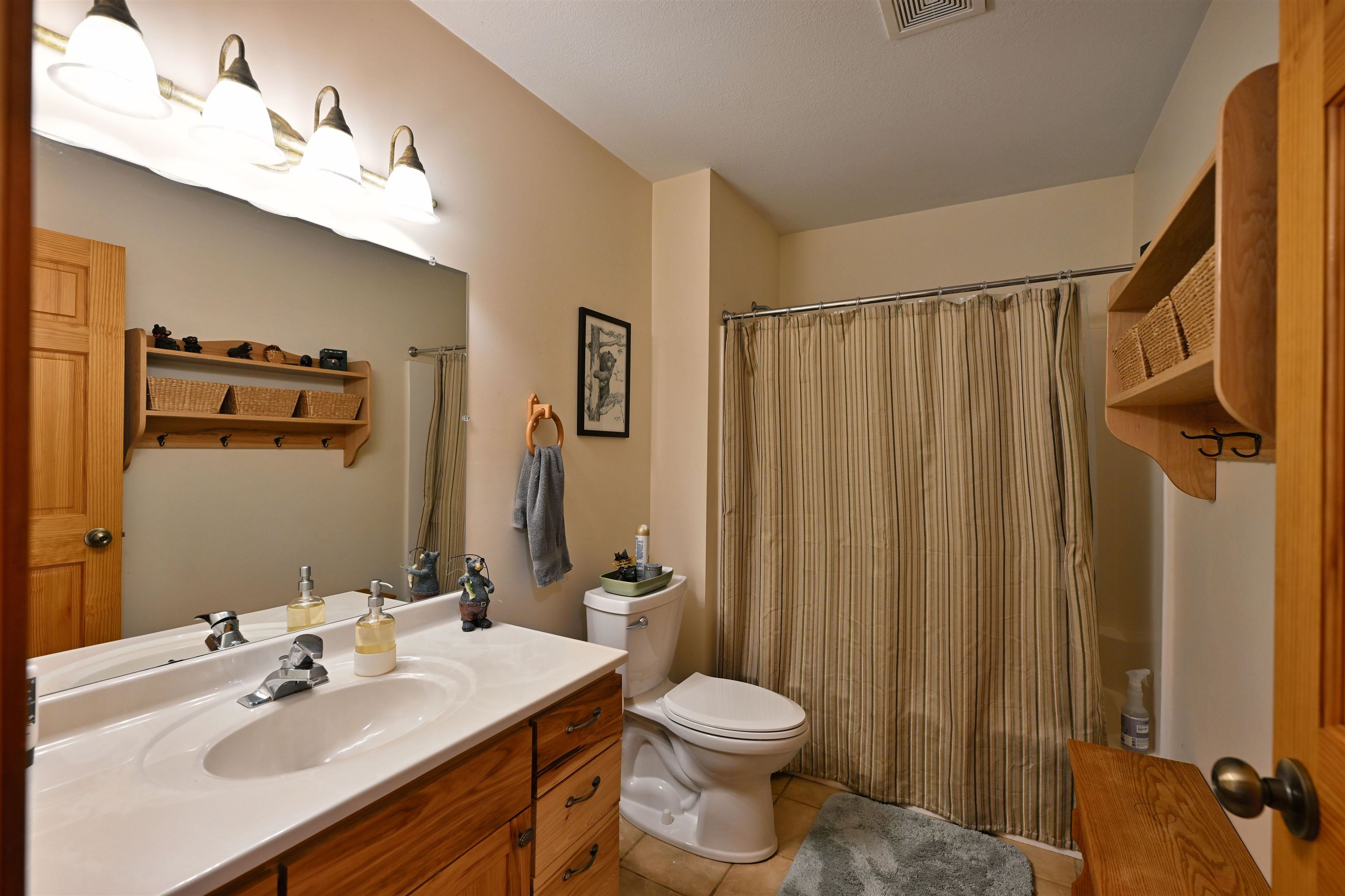 13672 East Short Road Gordon, WI 54838 - Photo 59 of 75 Full bathroom with light tile patterned flooring and vanity