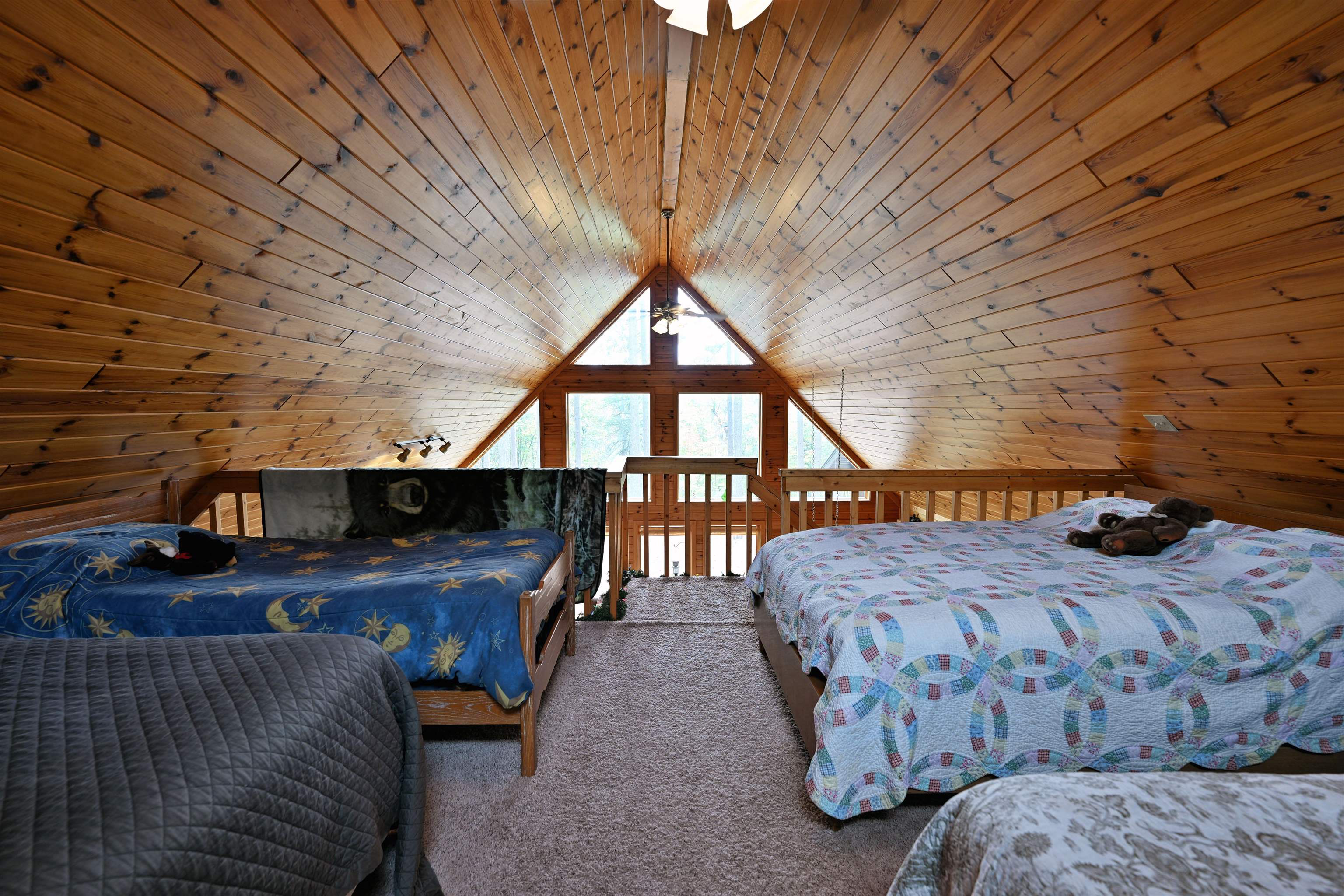 13672 East Short Road Gordon, WI 54838 - Photo 71 of 75 Bedroom with wooden ceiling, carpet, wooden walls, and lofted ceiling