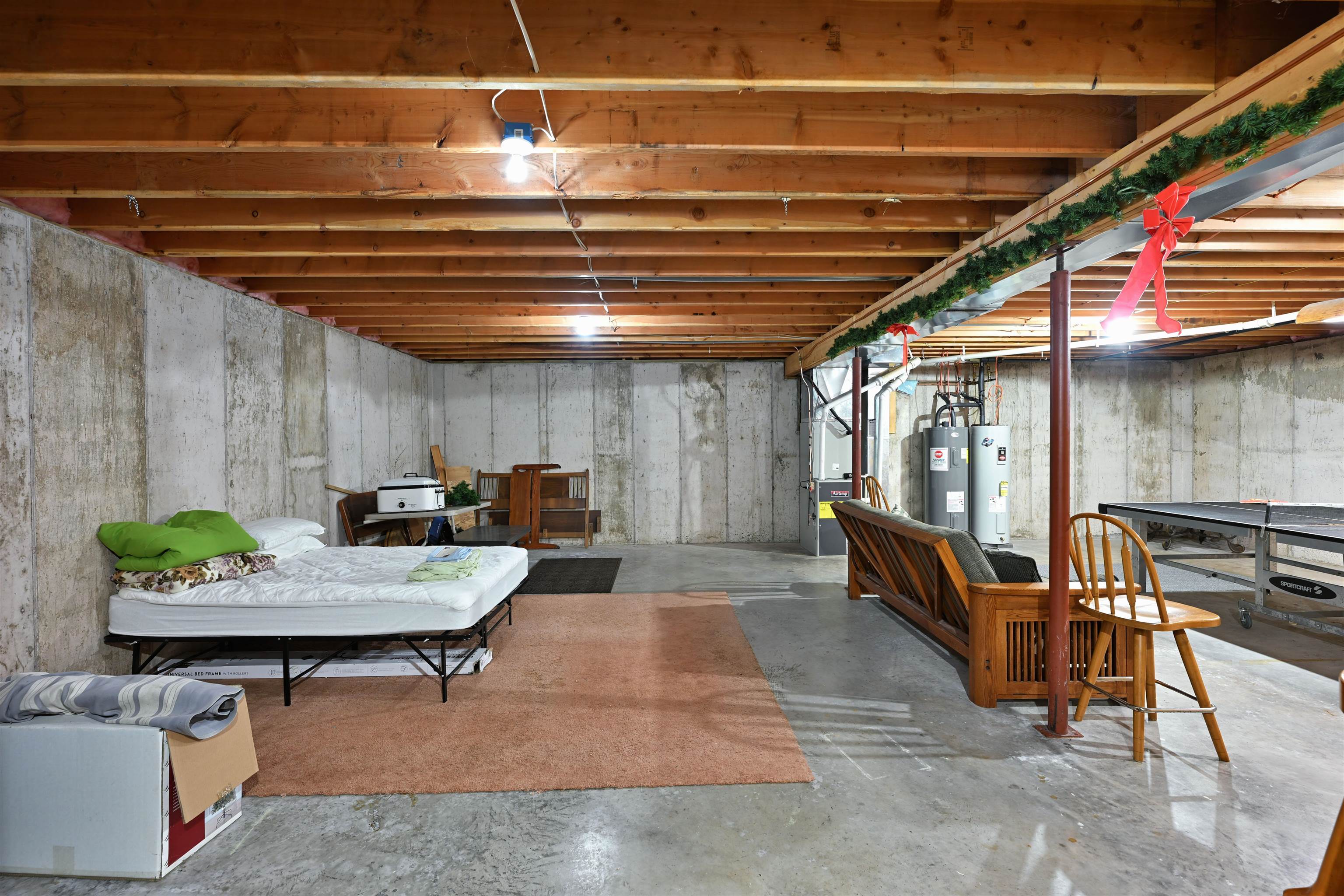 13672 East Short Road Gordon, WI 54838 - Photo 72 of 75 Unfinished below grade area featuring heating unit and water heater