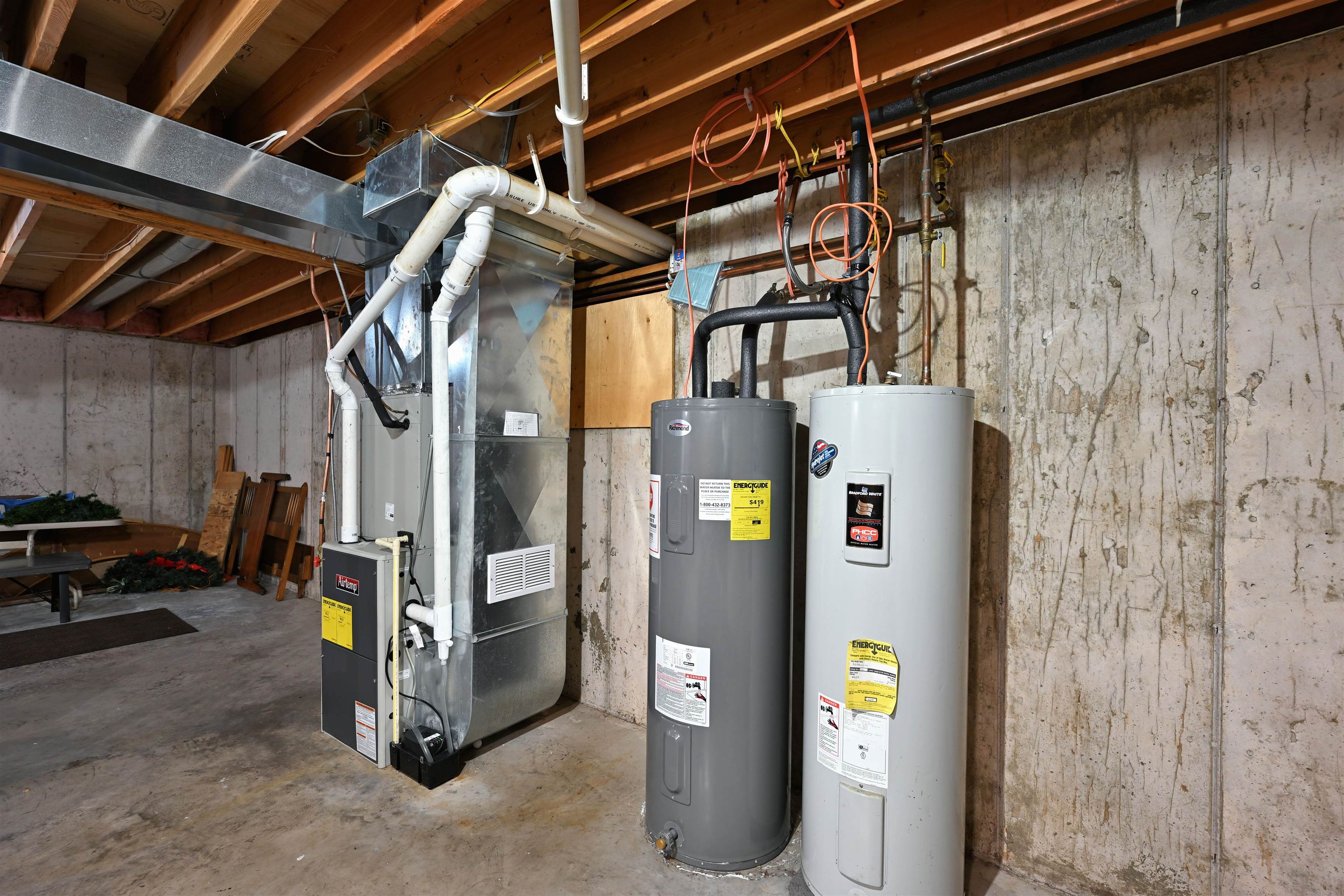 13672 East Short Road Gordon, WI 54838 - Photo 75 of 75 Utility room with electric water heater and heating unit