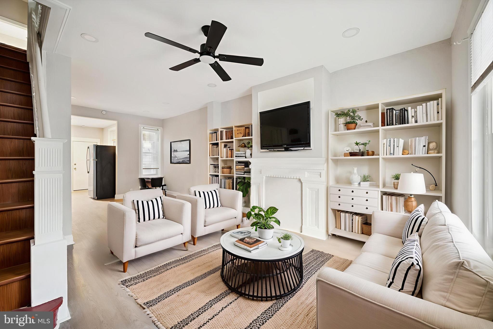 5517 Jane Street Philadelphia, PA 19138 - Photo 1 of 19 a living room with furniture a fireplace and a flat screen tv