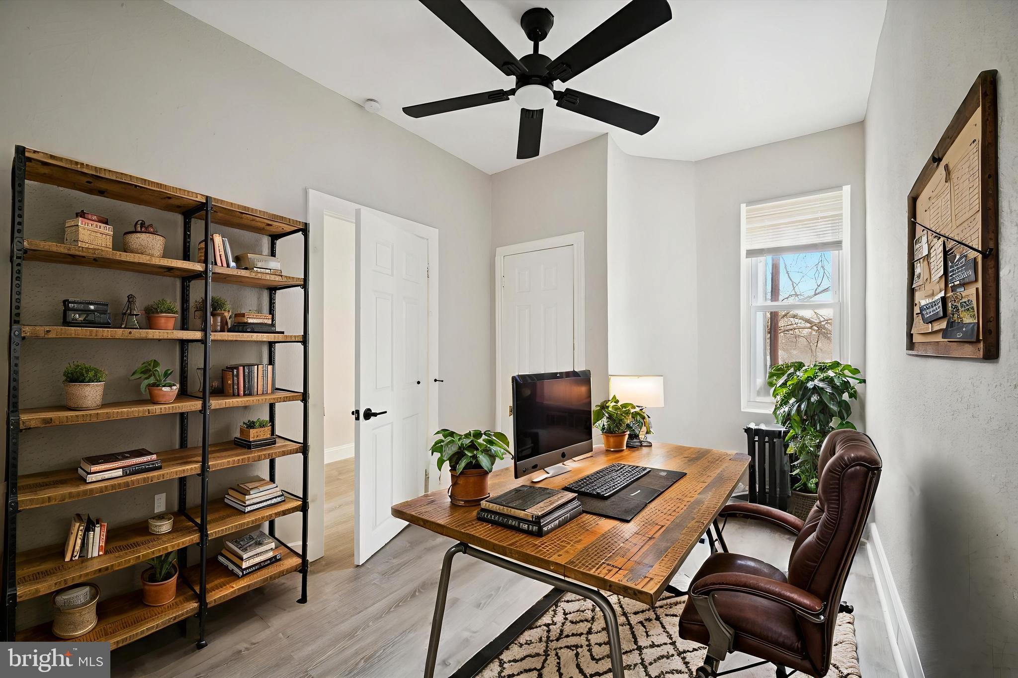 5517 Jane Street Philadelphia, PA 19138 - Photo 12 of 19 a view of a workspace with furniture and a potted plant