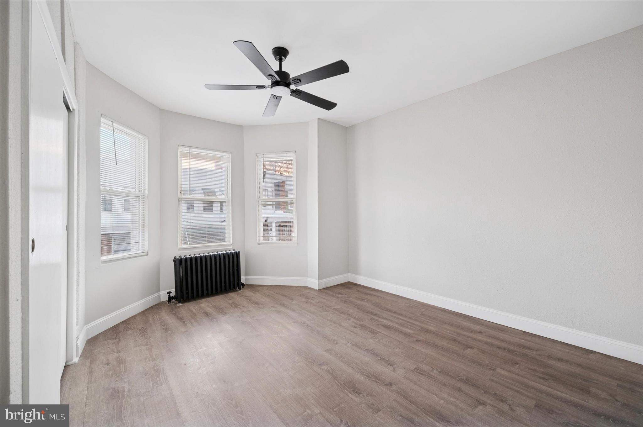 5517 Jane Street Philadelphia, PA 19138 - Photo 16 of 19 a view of empty room with wooden floor and fan