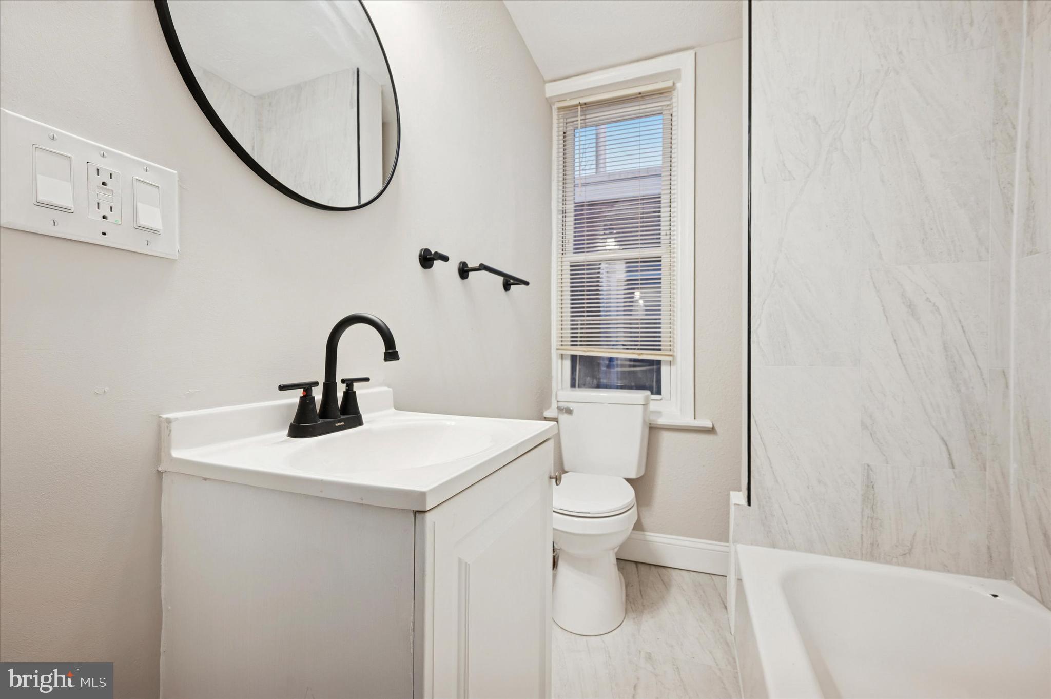 5517 Jane Street Philadelphia, PA 19138 - Photo 17 of 19 a bathroom with a sink and a mirror