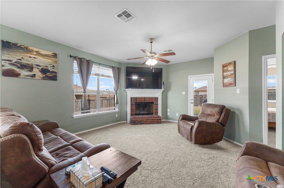308 Kayla Street Troy, TX 76579 - Photo 15 of 32 a living room with furniture and a fireplace