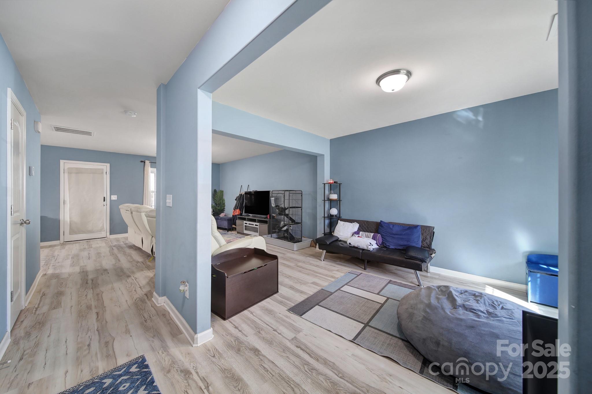 1708 Millwood Road Lancaster, SC 29720 - Photo 11 of 40 a living room with furniture and a wooden floor