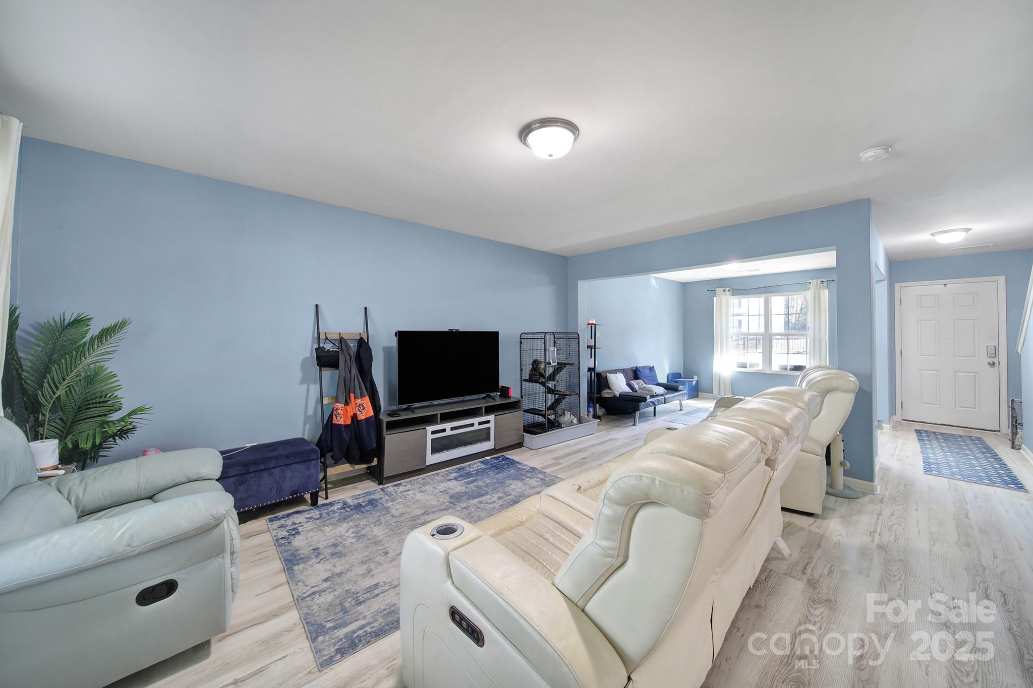 1708 Millwood Road Lancaster, SC 29720 - Photo 16 of 40 a living room with furniture and a flat screen tv