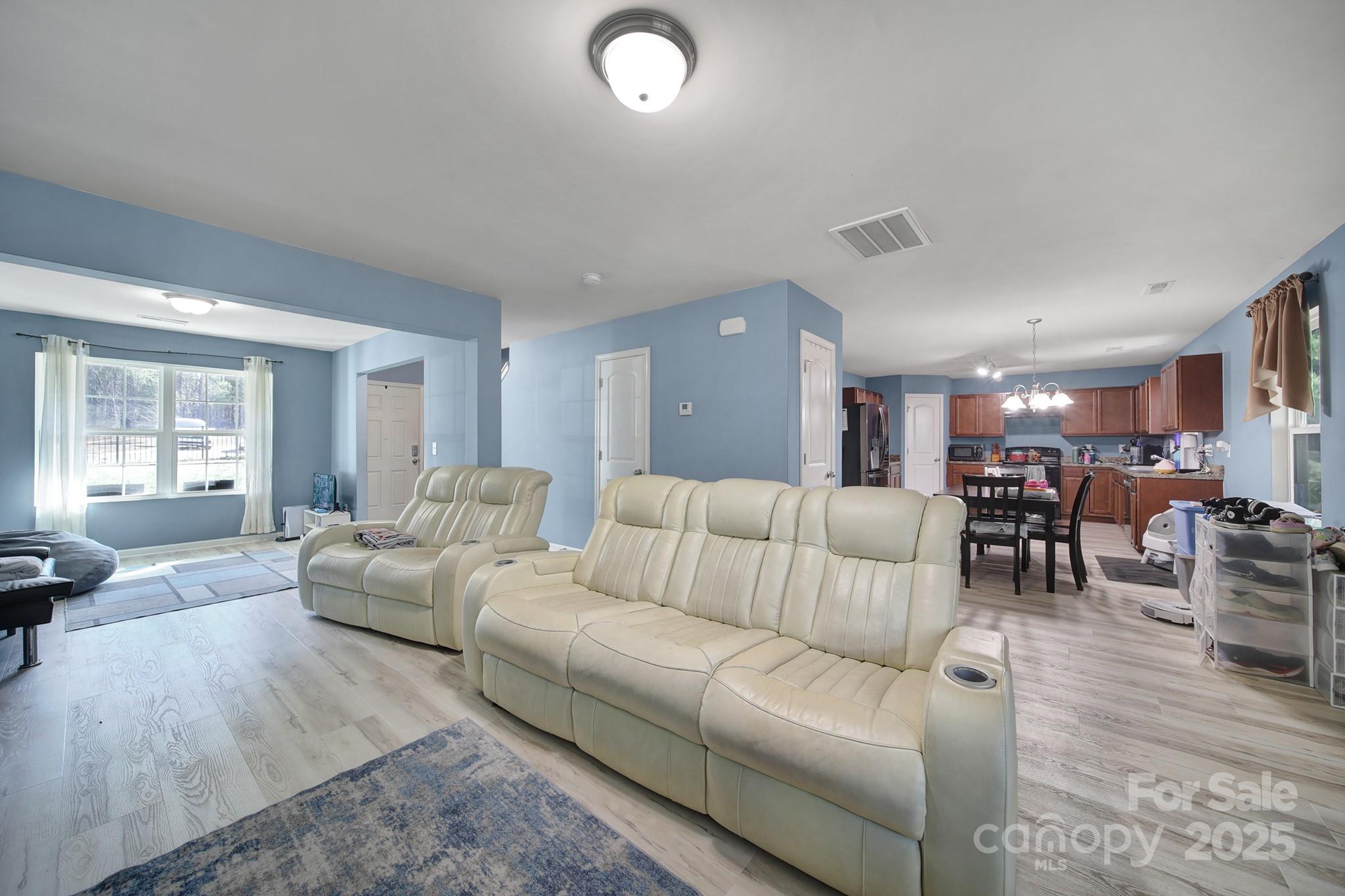 1708 Millwood Road Lancaster, SC 29720 - Photo 17 of 40 a living room with furniture and wooden floor
