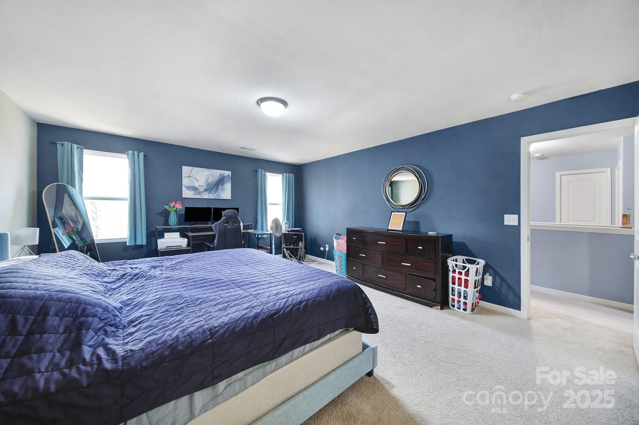 1708 Millwood Road Lancaster, SC 29720 - Photo 27 of 40 a bedroom with a bed and dresser with mirror