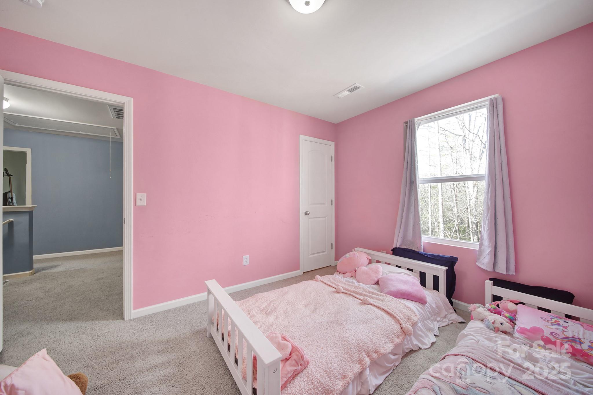 1708 Millwood Road Lancaster, SC 29720 - Photo 33 of 40 a bedroom with pink walls and pink bed