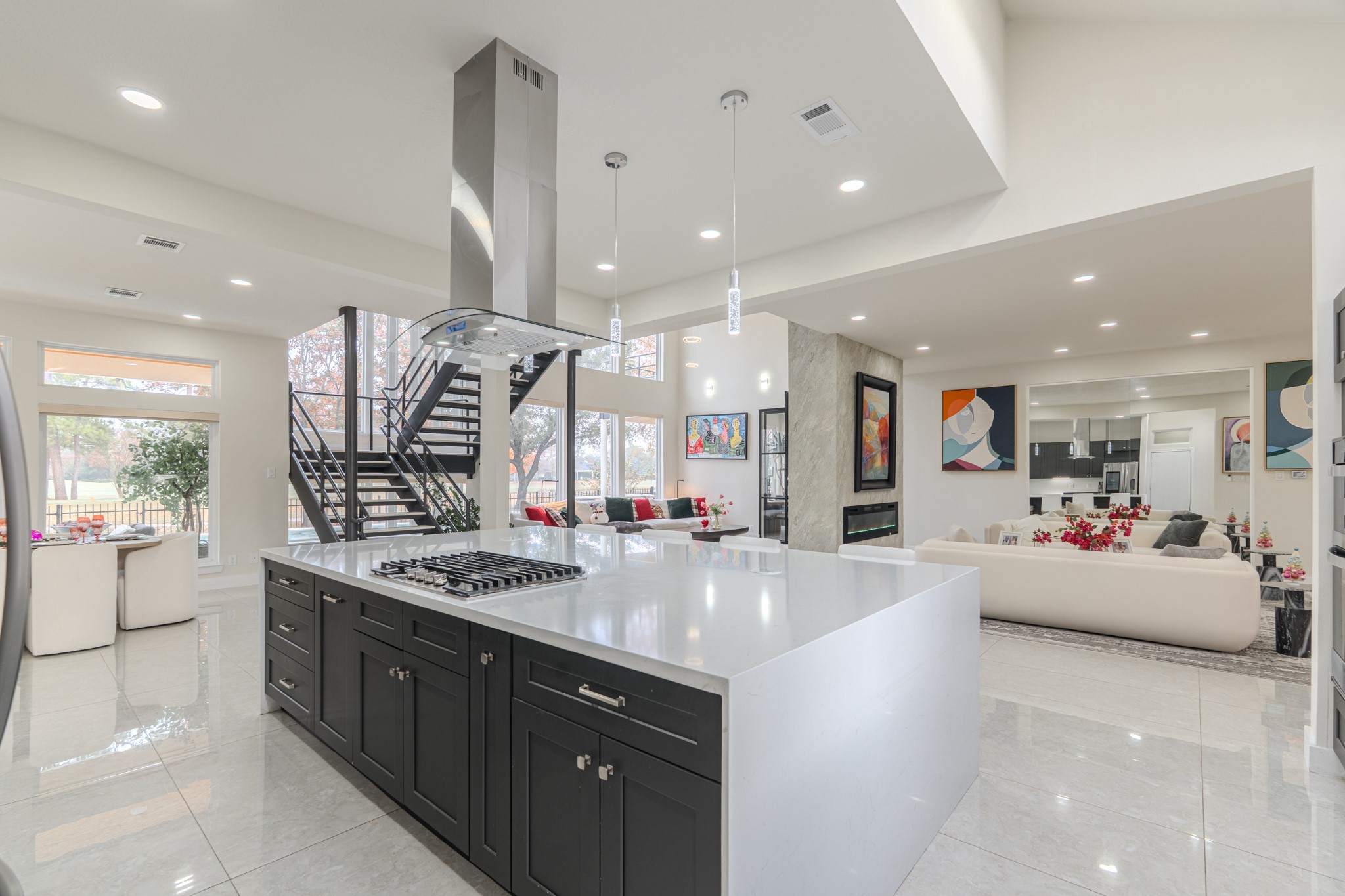 6510 Sussex Court Spring, TX 77389 - Photo 18 of 47 a large kitchen with stainless steel appliances a large counter top a stove and a sink