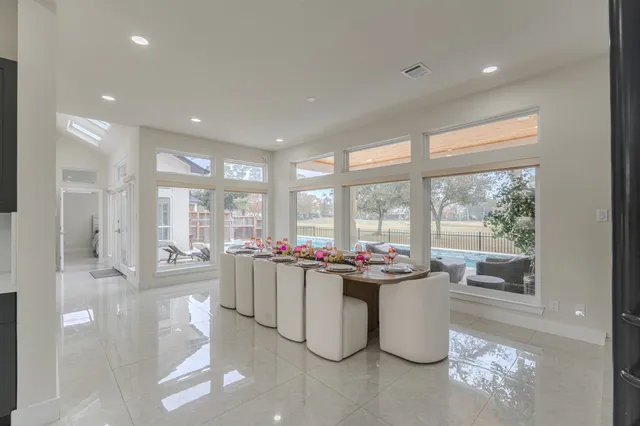 a kitchen with a sink and living room