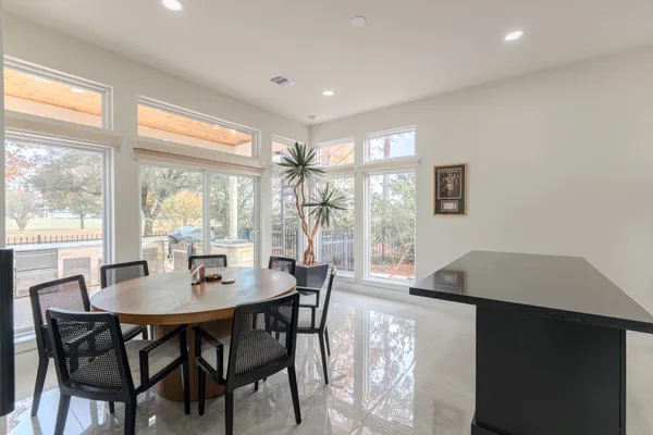 a view of a dining room with furniture window and outside view